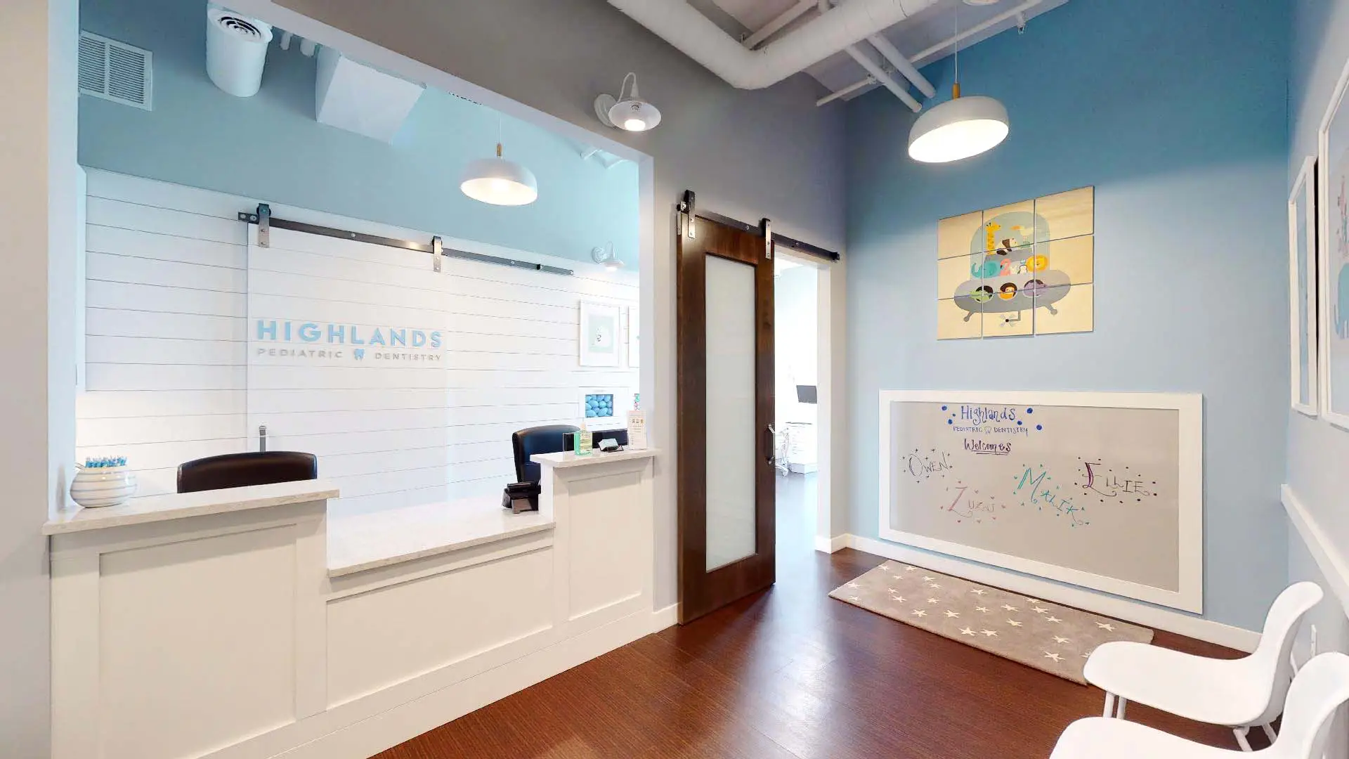 Bright pediatric clinic reception with blue walls